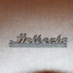 vintage Holbert’s dealership emblem