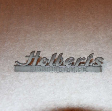 vintage Holbert’s dealership emblem
